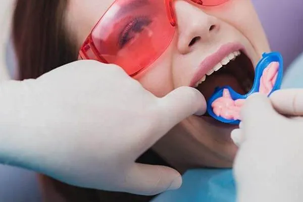 Clinician carrying out fluoride applications at Aurum Dental Clinic